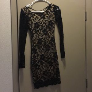 Black and nude lace dress with open back studs